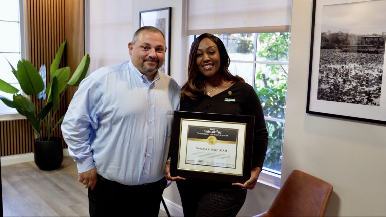 Rich and Tia with National Outstanding CSR of the Year Certificate.