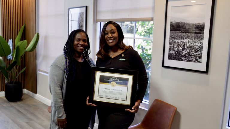 LaToya and Tia with National Outstanding CSR of the Year Certificate.